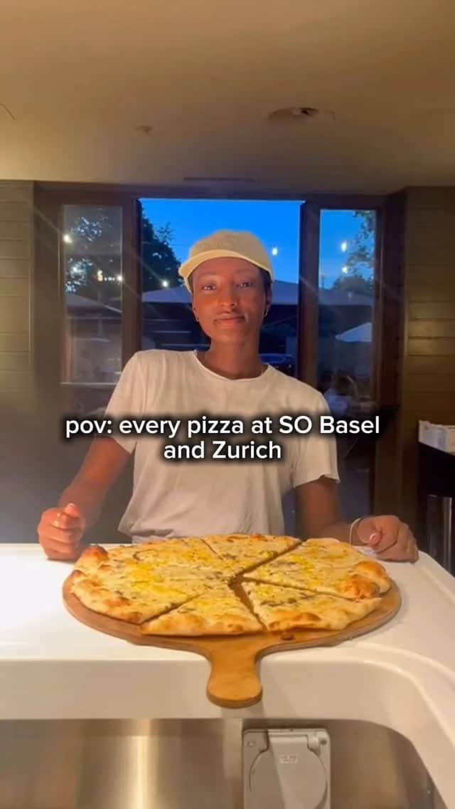 SO Pizza team serving a whole pizza